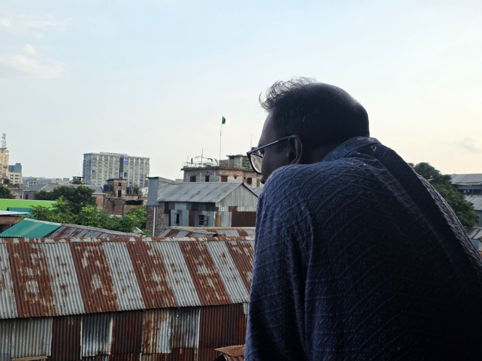 Looking out over the tin rooftops of Dhaka from the studio roof